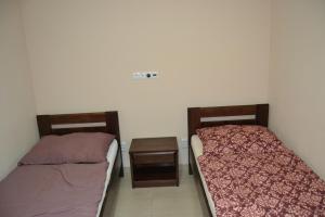 A bed or beds in a room at Reštaurácia-penzión ALTANA
