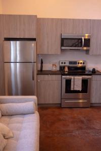 A kitchen or kitchenette at Center City Loft, CONTACTLESS CHECK IN, Mayor's Study