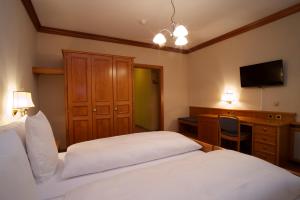 Ένα ή περισσότερα κρεβάτια σε δωμάτιο στο Hotel Le Prese