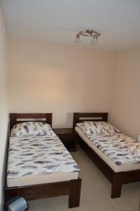 A bed or beds in a room at Reštaurácia-penzión ALTANA