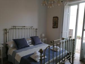 A bed or beds in a room at Boutique Rooms and Breakfast GranVeliero