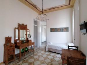A bed or beds in a room at Boutique Rooms and Breakfast GranVeliero