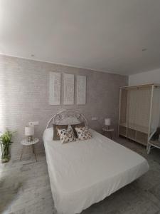Postel nebo postele na pokoji v ubytování Apartamento Laura