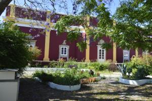 a house with a garden in front of it at Hortas de Baixo, Luz de Tavira in Tavira