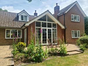 an extension to a house with a conservatory at Ha'penny Acre in Sherfield English