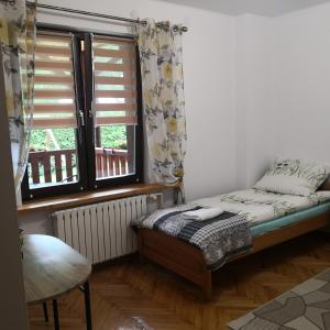 Ліжко або ліжка в номері Apartament Na Rozdrożu