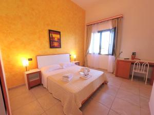 Postel nebo postele na pokoji v ubytování Hotel Alba Chiara Sant'Andrea Salento