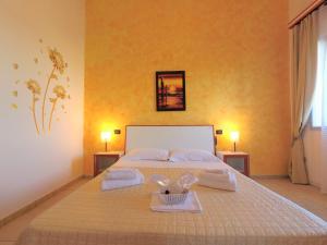 Postel nebo postele na pokoji v ubytování Hotel Alba Chiara Sant'Andrea Salento