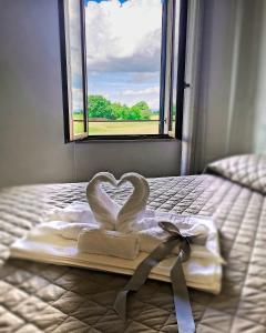 Postel nebo postele na pokoji v ubytování Castelvecchio B&B