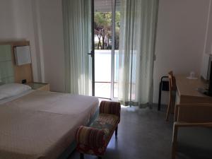 Postel nebo postele na pokoji v ubytování Hotel Sahara