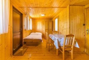 En eller flere senge i et værelse på Litoral Domki Lubkowo