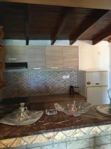 a kitchen with two sinks and a counter top at Andronikis House in Sykia Chalkidikis +93 photos