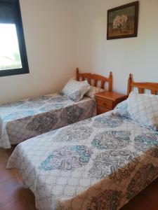 Posteľ alebo postele v izbe v ubytovaní BAJO con JARDÍN PROPIO EN VALLE DEL ESTE GOLF!!