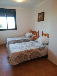 Posteľ alebo postele v izbe v ubytovaní BAJO con JARDÍN PROPIO EN VALLE DEL ESTE GOLF!!