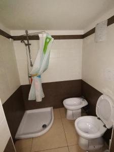 a bathroom with a toilet and a bidet at Appartamento SeaLife in San Foca