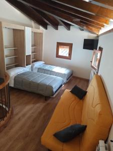 Łóżko lub łóżka w pokoju w obiekcie La Caseta
