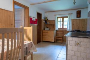 a kitchen with a sink and a counter top at Holiday Home Srednja vas in Srednja Vas v Bohinju +58 photos