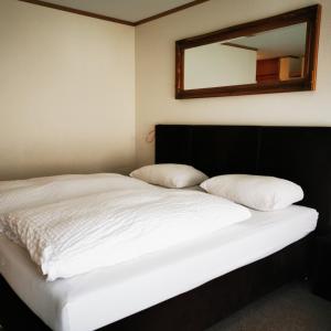 Postel nebo postele na pokoji v ubytování FeWo Fernsicht Crystal