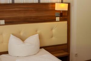 Postel nebo postele na pokoji v ubytování Hotel-Restaurant Laux