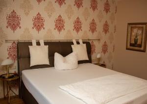 Postel nebo postele na pokoji v ubytování Hotel-Restaurant Laux