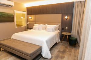 Cama ou camas em um quarto em Radisson Blu Belo Horizonte Savassi