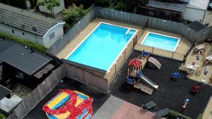 an overhead view of a swimming pool on a building at Chalet nr 30 in Putten in Putten