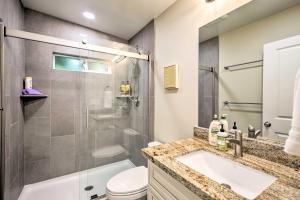 a bathroom with a shower and a sink and a toilet at Coastal Carlsbad Home 1 Mi to Beach and Downtown in Carlsbad +21 photos