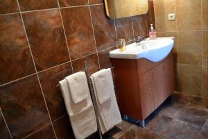 a bathroom with a sink and a mirror at Casa D'avo in Geres +29 photos
