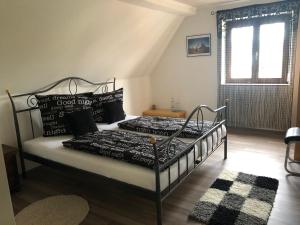 a bedroom with two beds and a window at Pension Restaurant Ewald in Bischofsheim an der Rhön