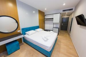 Postel nebo postele na pokoji v ubytování Delight Hotel