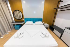 Postel nebo postele na pokoji v ubytování Delight Hotel