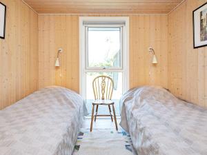 Three-Bedroom Holiday home in Otterup 4 tesisinde bir odada yatak veya yataklar