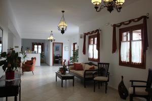 a living room with a couch and chairs at Galini in Agia Irini Milos