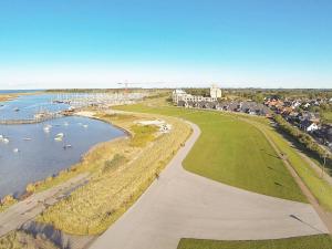 an aerial view of a river with boats in the water at 6 person holiday home in Wendtorf in Wendtorf