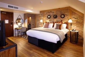 מיטה או מיטות בחדר ב-Hotel Indigo York, an IHG Hotel