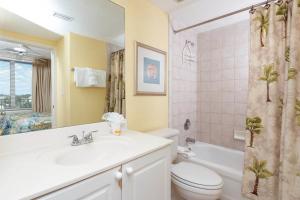 a bathroom with a sink and a toilet and a shower at Island Princess Condos in Fort Walton Beach