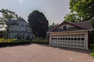 a large house with a garage at 2W Lake in Skaneateles