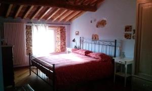 A bed or beds in a room at La Coccinella B&B