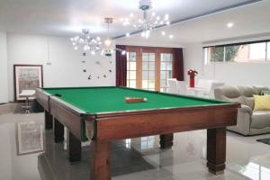 a living room with a pool table in it at By The Bay in Kingston Beach