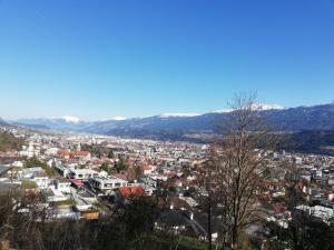 a view of a city with mountains in the background at Haus Georg in Innsbruck