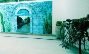 a bike parked in front of a mirror at La Badia in Messina