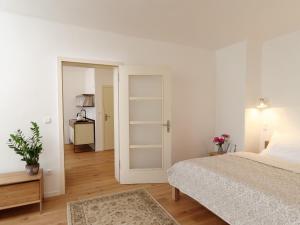 Posteľ alebo postele v izbe v ubytovaní Bonviván Apartments