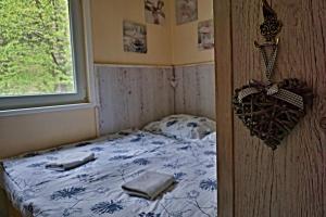 Postel nebo postele na pokoji v ubytování Chata Bačova skala