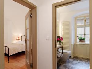Postel nebo postele na pokoji v ubytování Bonviván Apartments