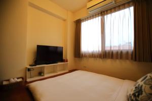 TV o dispositivi per l'intrattenimento presso 影拾光民宿Shadow of Light B&B