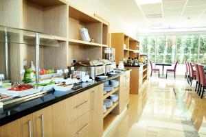 a large kitchen with a counter and a dining room at Holiday Inn Express Istanbul-Altunizade, an IHG Hotel in Istanbul