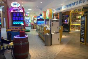a mall with a video game arcade and a game machine at Edinburgh - Seton Sands-Salsa Caravan-Pet Friendly in Port Seton