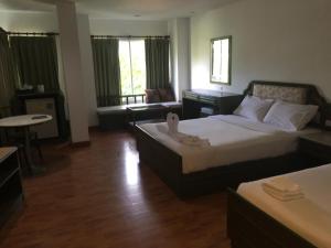Voodi või voodid majutusasutuse Chaweng Tara Hotel toas