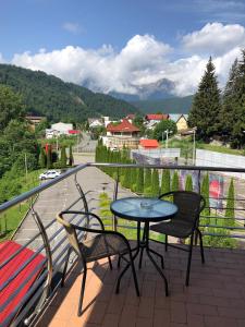 Balcon ou terrasse dans l'établissement Azuga Ski & Bike Resort