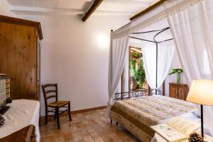 Ένα ή περισσότερα κρεβάτια σε δωμάτιο στο Tortuga Casa Vacanze